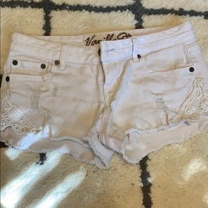 White cutoff denim shorts lace detail